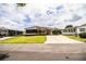 Well-maintained single-story home featuring a covered carport and manicured lawn at 1565 Heather Hill Dr, Lakeland, FL 33810