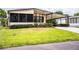 Single-story home with a covered carport and well-maintained green lawn at 1565 Heather Hill Dr, Lakeland, FL 33810