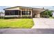 Attractive single-story home with a covered carport and manicured green lawn at 1565 Heather Hill Dr, Lakeland, FL 33810