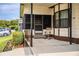 Cozy front porch with rocking chair and manicured landscaping at 1565 Heather Hill Dr, Lakeland, FL 33810