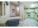 Cozy kitchen area with vintage cabinets and quaint floral wallpaper, plus a table at 1565 Heather Hill Dr, Lakeland, FL 33810