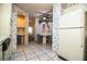 Eat-in kitchen with white cabinets, vintage appliances, and laminate countertops at 1565 Heather Hill Dr, Lakeland, FL 33810