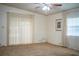 Comfortable living room featuring neutral walls, carpet flooring, and ample natural light, creating a relaxing space at 1565 Heather Hill Dr, Lakeland, FL 33810