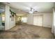Expansive living room with a dining area, carpet flooring, and great natural light, ideal for entertaining at 1565 Heather Hill Dr, Lakeland, FL 33810