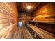 Inviting cedar sauna with wooden benches and ample space for relaxation at 1565 Heather Hill Dr, Lakeland, FL 33810