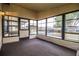 Sunroom with large windows providing ample natural light and scenic outdoor views at 1565 Heather Hill Dr, Lakeland, FL 33810