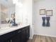 Modern bathroom with double vanity, quartz countertops, and stylish decorative accents at 1806 Teleford Rd, St Cloud, FL 34771