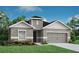 Charming single-Gathering home with a manicured lawn and attached two-car garage at 1806 Teleford Rd, St Cloud, FL 34771