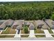 Aerial view of homes with manicured lawns in a quiet neighborhood at 1825 Wallace Manor Ln, Winter Haven, FL 33880