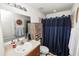 Bathroom with shower/tub combo, single sink, and cabinet at 1825 Wallace Manor Ln, Winter Haven, FL 33880