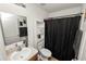 Bathroom featuring a single sink vanity and tub shower combo at 1825 Wallace Manor Ln, Winter Haven, FL 33880