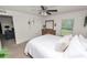 Bedroom with a ceiling fan, and a view into the living room at 1825 Wallace Manor Ln, Winter Haven, FL 33880