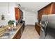 Modern kitchen with stainless steel appliances, granite countertops, and abundant cabinetry at 1825 Wallace Manor Ln, Winter Haven, FL 33880