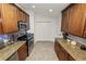 Functional kitchen boasts granite counters, stainless steel appliances, and plenty of storage space at 1825 Wallace Manor Ln, Winter Haven, FL 33880