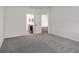 Spacious bedroom featuring neutral walls, carpet flooring and ensuite bathroom entrance at 2033 Summerlake Dr, Auburndale, FL 33823