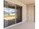 Outdoor patio with a screened sliding door and view of the backyard at 2033 Summerlake Dr, Auburndale, FL 33823