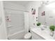 Clean bathroom with a shower, tub, vanity, and modern finishes at 2039 Rosewood Cir, Lakeland, FL 33810