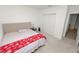 Comfortable bedroom with tufted headboard, side tables, and carpet flooring at 2039 Rosewood Cir, Lakeland, FL 33810