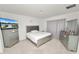 Cozy bedroom with a stylish gray bed frame and matching dresser at 2039 Rosewood Cir, Lakeland, FL 33810