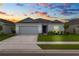 Charming single-story home with a well-maintained front yard and gray exterior paint at 2039 Rosewood Cir, Lakeland, FL 33810