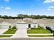 Aerial view of a home with a manicured lawn, situated in a neighborhood at 2039 Rosewood Cir, Lakeland, FL 33810