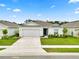 Charming single-story home with a well-manicured lawn and attached two-car garage at 2039 Rosewood Cir, Lakeland, FL 33810