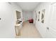 Inviting hallway featuring stylish console table with gold accents and modern wall art at 2039 Rosewood Cir, Lakeland, FL 33810
