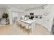 Bright kitchen featuring a large island with seating, white cabinets, and modern appliances at 2039 Rosewood Cir, Lakeland, FL 33810