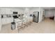 Spacious kitchen with a center island, stainless steel appliances, and white cabinets at 2039 Rosewood Cir, Lakeland, FL 33810