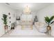 Elegant living room featuring sophisticated decor, plush seating, and a stunning chandelier at 2039 Rosewood Cir, Lakeland, FL 33810