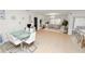 Bright, open living space combining dining and living areas with stylish, modern furniture at 2039 Rosewood Cir, Lakeland, FL 33810