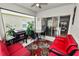 Relaxing screened patio with grill, ceiling fan, and comfortable seating area at 2039 Rosewood Cir, Lakeland, FL 33810