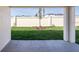 Private backyard space with a concrete patio overlooking a lush green lawn and privacy fence at 2206 Oldham Ct, Haines City, FL 33844