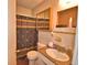Functional bathroom with a shower/tub combo, vanity with sink, and ample lighting at 224 Raymond Ave, Frostproof, FL 33843
