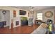 Comfortable living room with wood floors, entertainment center, and relaxing seating at 224 Raymond Ave, Frostproof, FL 33843