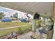 Relaxing porch with comfortable seating and a view of the neighborhood at 224 Raymond Ave, Frostproof, FL 33843