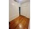 Cozy bedroom with hardwood floors and a closet, providing a simple and functional space for relaxation at 236 E Seminole Ave, Lake Wales, FL 33853