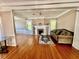 Living room showcasing hardwood floors, fireplace, and comfortable seating, creating a warm and inviting space at 236 E Seminole Ave, Lake Wales, FL 33853