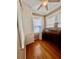 Well-lit home office featuring hardwood floors, ample storage, and a vintage desk, creating a functional workspace at 236 E Seminole Ave, Lake Wales, FL 33853