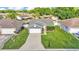 Aerial shot of the property showing the home's layout, landscaping, and neighborhood at 242 Kings Pond Sw Ave, Winter Haven, FL 33880