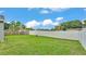Expansive backyard with a well-manicured lawn and privacy fence, perfect for outdoor activities at 242 Kings Pond Sw Ave, Winter Haven, FL 33880