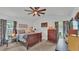 Cozy bedroom with ceiling fan, soft lighting, and neutral tones, creating a relaxing and inviting retreat at 242 Kings Pond Sw Ave, Winter Haven, FL 33880