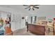 Comfortable bedroom with plush bedding, ceiling fan, and ample natural light, offering a tranquil space to unwind at 242 Kings Pond Sw Ave, Winter Haven, FL 33880
