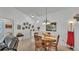 Bright dining room adjacent to the living space, featuring neutral walls and a pendant light at 242 Kings Pond Sw Ave, Winter Haven, FL 33880