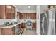 This efficient kitchen features stainless steel appliances, granite countertops, and ample wood cabinetry for storage at 242 Kings Pond Sw Ave, Winter Haven, FL 33880