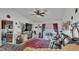 Comfortable living room with a ceiling fan, large TV, and access to an outdoor patio area at 242 Kings Pond Sw Ave, Winter Haven, FL 33880