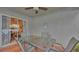 Screened patio features a glass table and view of the interior, perfect for relaxing and entertaining at 242 Kings Pond Sw Ave, Winter Haven, FL 33880