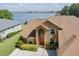Aerial view of a home showcasing its lakeside location and well-maintained landscape at 254 Lake Tennessee Dr, Auburndale, FL 33823