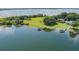 Scenic aerial view of a waterfront home with a private dock and access to a large lake at 254 Lake Tennessee Dr, Auburndale, FL 33823