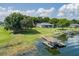 Beautiful lakefront home with a private boat dock and lush green lawn at 254 Lake Tennessee Dr, Auburndale, FL 33823